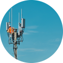 Technician working on a telecommunications tower.